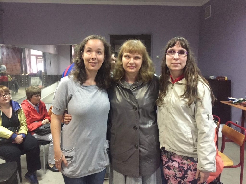 Laurel and Alyona, our Moscow team leader, meet new friends at a social for the blind that the foundation hosted.
