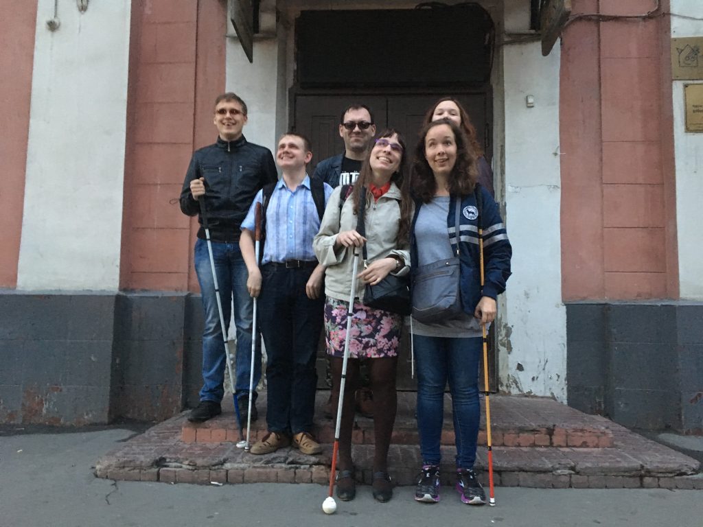 Laurel with new friends pose in front of the Time and Space Center for the Blind in Moscow.