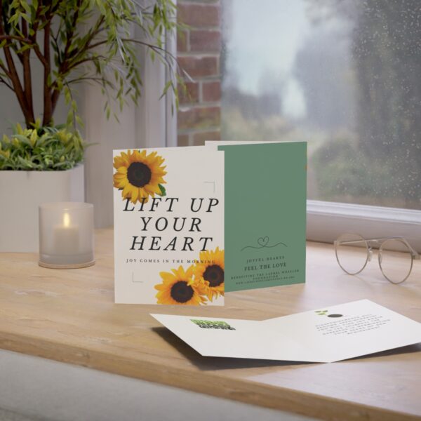 image of the Lift up Your Heart card displayed on a table top showing the cover and card interior